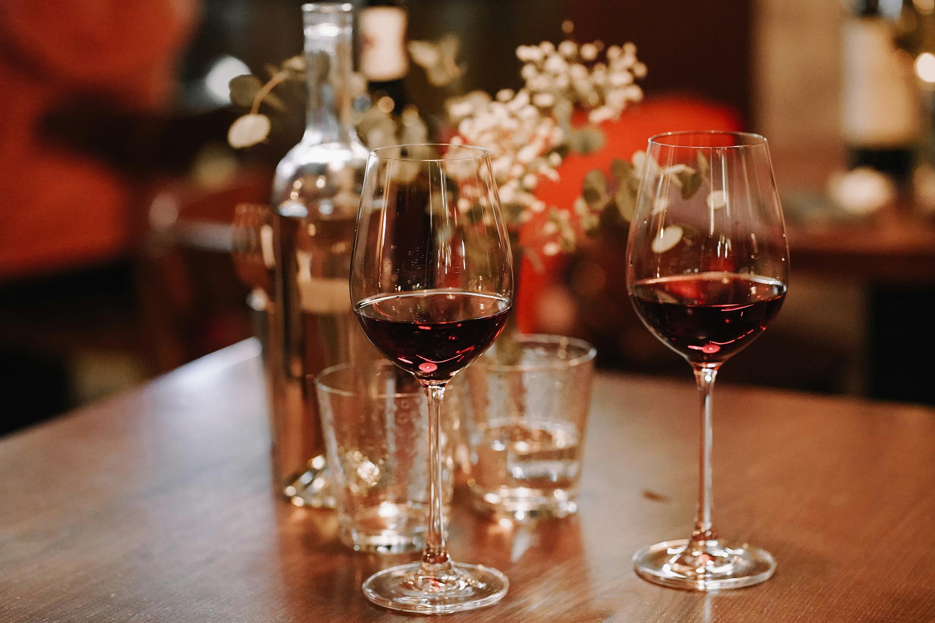 Wine glasses on a table with water